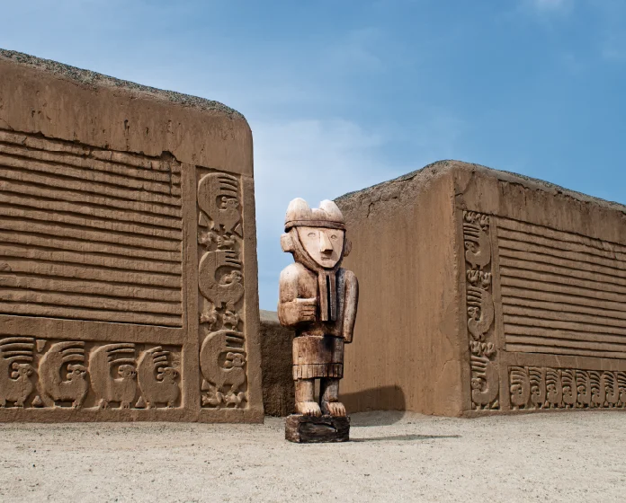 Wooden idol in front of a mud wall in the citadel of Chan Chan.
